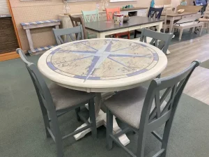 coastal sytle bar height dining table with green chairs